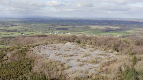 Establishing-aerial-shot-over-Finvarra-castle-and-Caesar's-Cairn-on-Knockma-Hill