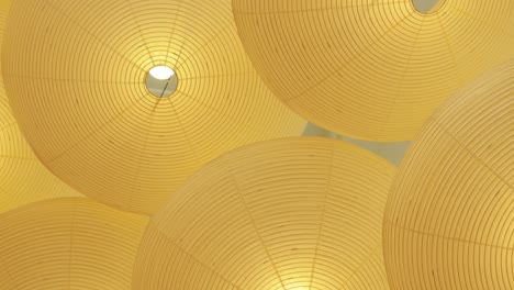 yellow lampshades from ceiling abstract