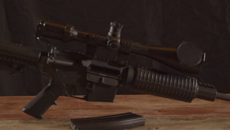 dolly in of unloaded ar-15 on a wooden surface