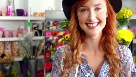 Beautiful-female-florist-standing-in-flower-shop