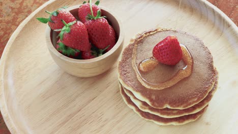 pancake with honey and strawberries