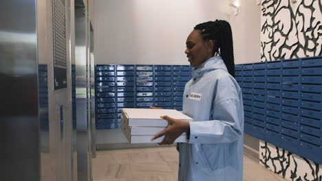 delivery woman holding carton boxes