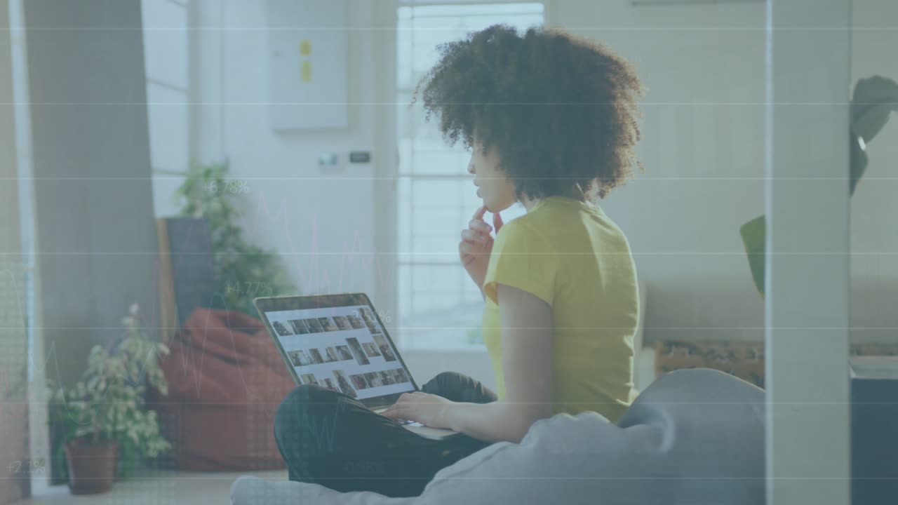 Animation of financial data processing over businesswoman using laptop