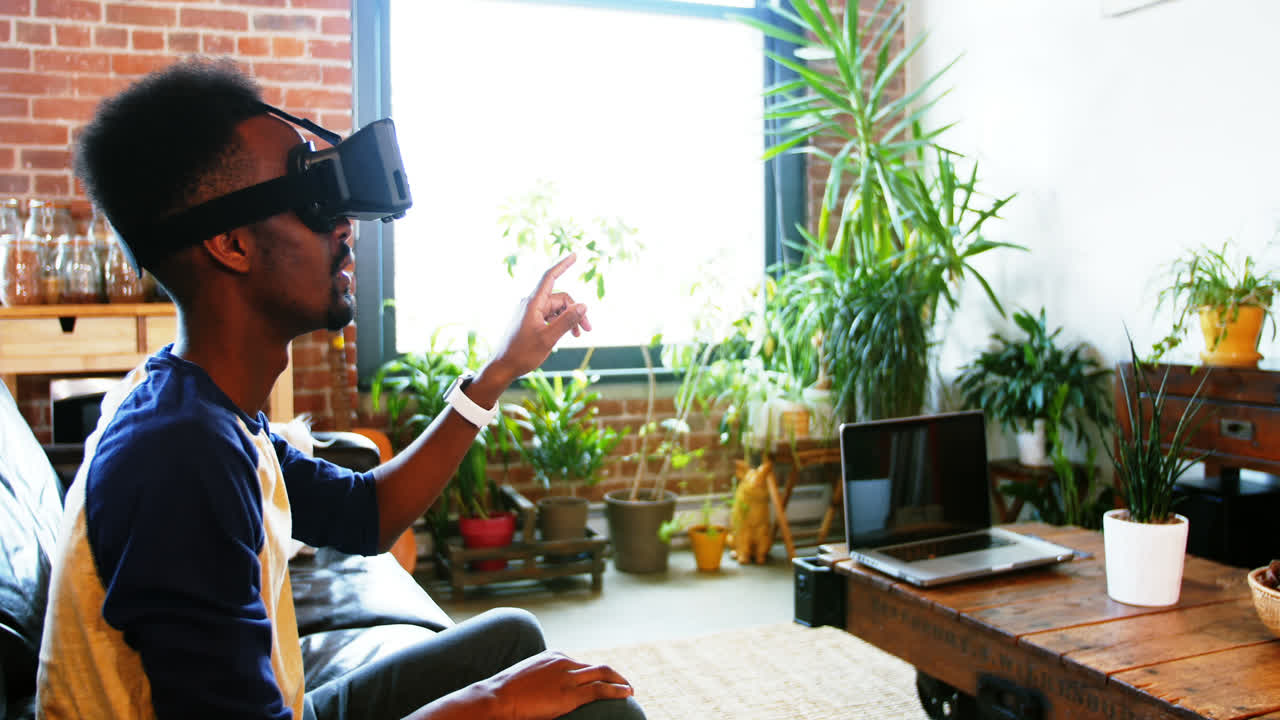 Man using virtual reality headset in the living room