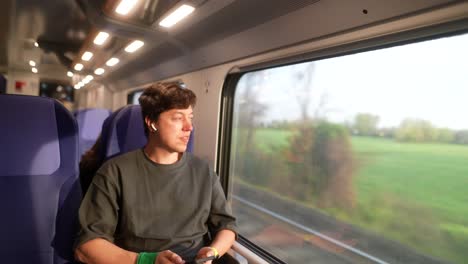 young man traveling by train