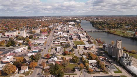 Downtown-Saginaw,-Michigan,-USA,-and-Saginaw-River-in-fall,-aerial-view