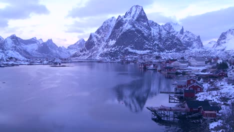 snow covers a beautiful view of a harbor and bay in a village in the arctic lofoten islands norway 2