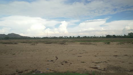 Sacred-Falgu-River-dry-waterbed-with-a-long-stretch-of-sand-dunes,-Bodhgaya,-Bihar,-India