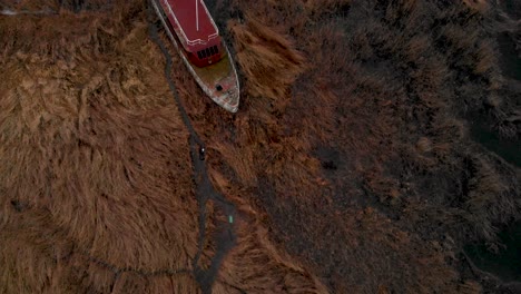 Drone-Flyby-Over-An-Old-Shipwreck-By-The-Shore-Of-Dabie-Lake-In-The-Village-Of-Lubczyna-In-Poland