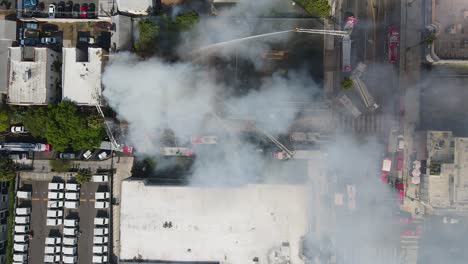 firefighters work hard to contain building fire