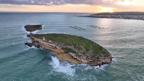 drone video panning around the saint paul's islands in malta at sunrise