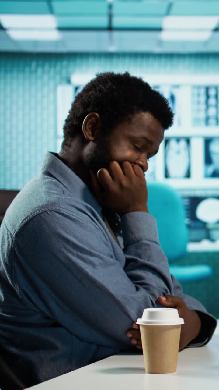 Thoughtful African American Man Waiting in Medical Office