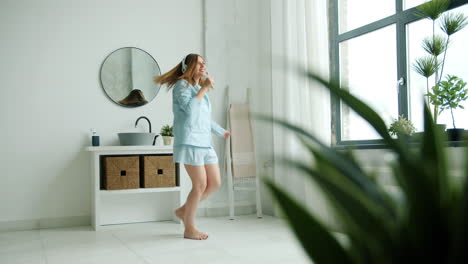 woman dancing in a bathroom