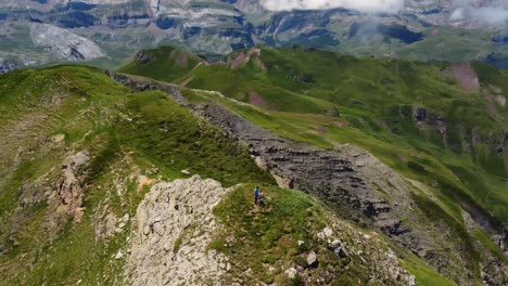 Aerial-and-spiral-view-of-a-mountain-summit-in-summer