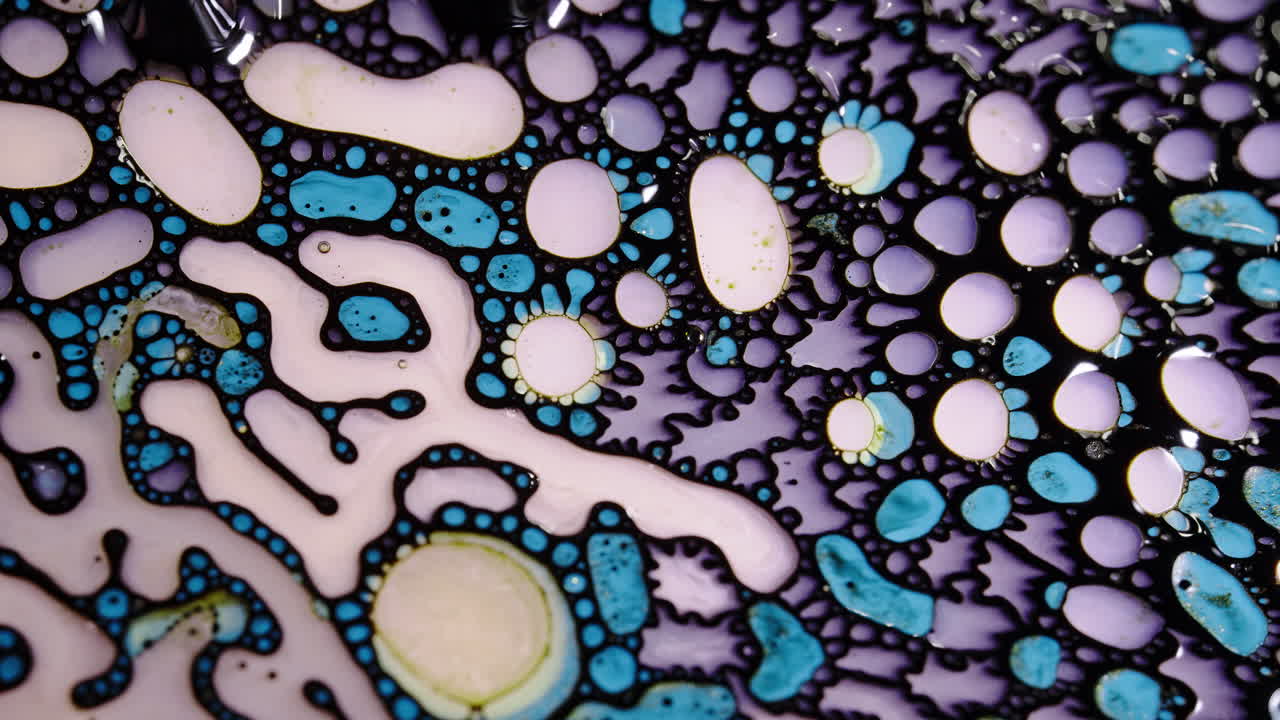 Abstract macro shot of colorful liquid patterns forming intricate organic shapes