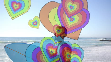 animación de corazones coloridos sobre un hombre afroamericano con una tabla de surf y caminando por la playa