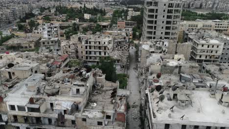 aerial view with a drone over the rooftop of the buildings of aleppo under the sunlight. view above the buildings in ruins of the syrian city  4k