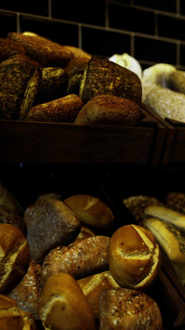 Freshly baked bread stacked on wooden racks in a bakery setting