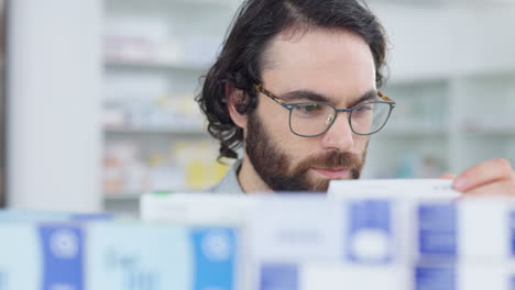 pharmacist checking medication inventory