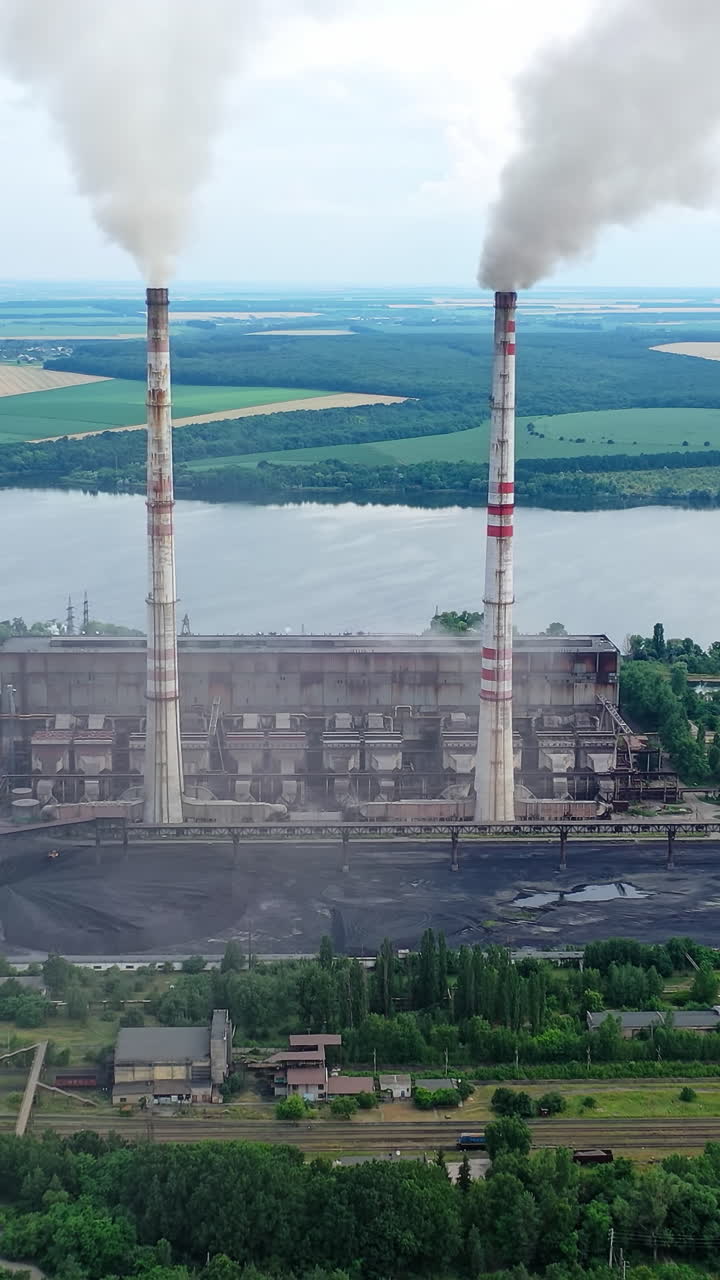 Plant pipes pollute atmosphere. Pollution of the environment of factory pipe with smoke