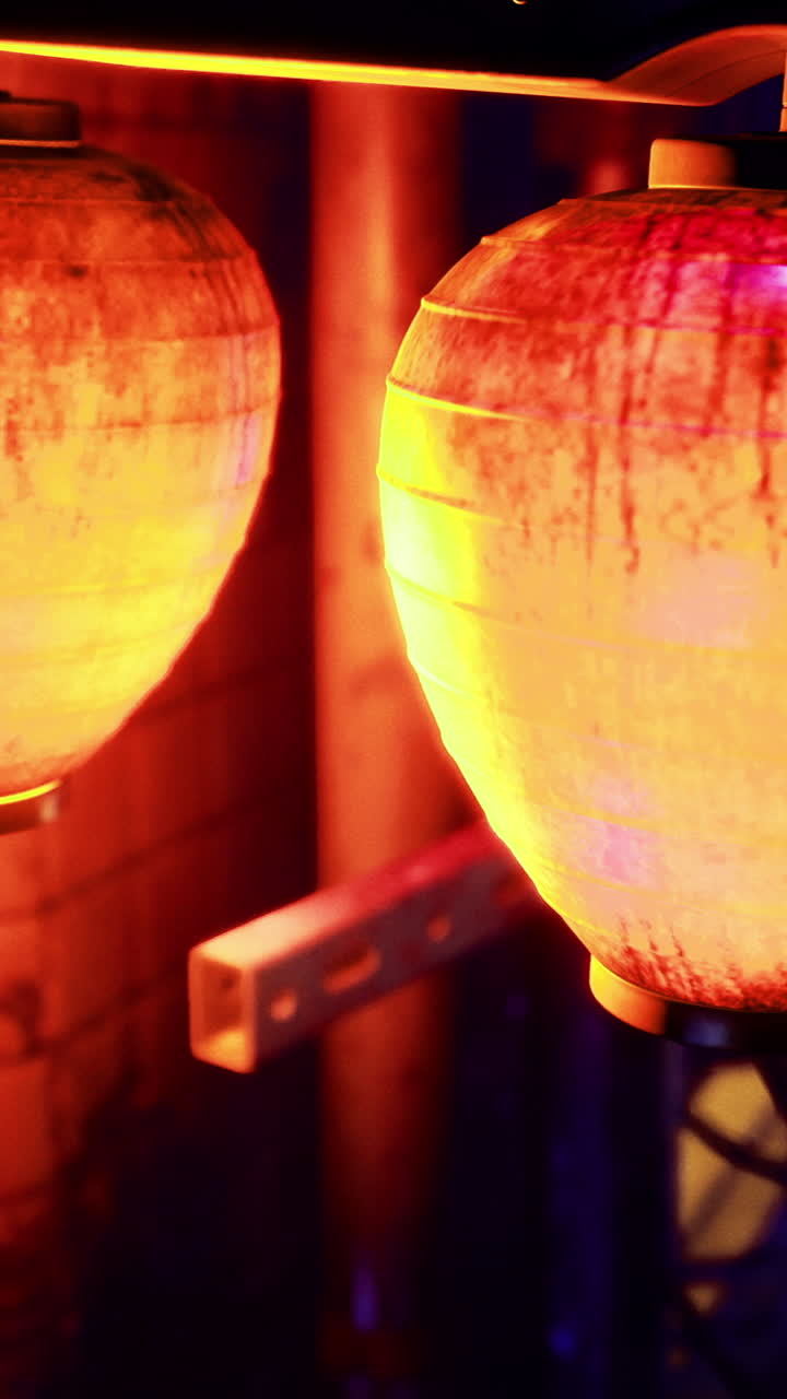 Beautiful illuminated lanterns hanging in a vibrant nightlife district