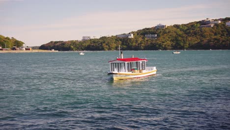 Cute-Tiny-Boat-Arriving-in-Toba-Bay-for-Ama-Pearl-Diving-Display-4k