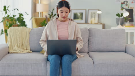 woman, headphones and laptop with winner on home