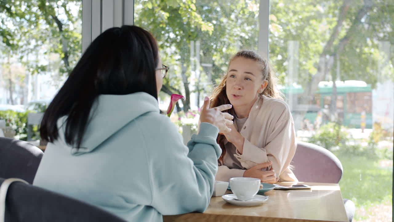 Women friends having coffee at a cafe