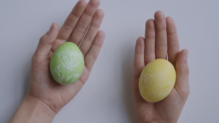 Decorated Easter Eggs in Hands