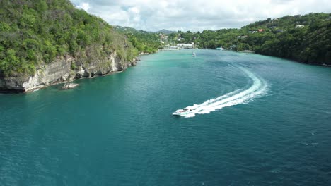 speedboat coming out of marigot bay, captured by drone