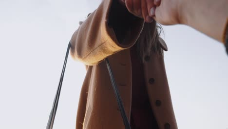 cinematic shot, man giving young beautiful woman a hand to help get down near epic eiffel tower view, paris slow motion.