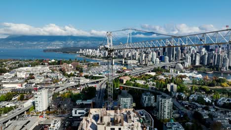 Tower-Crane-On-Top-Of-High-rise-Building-Under-Construction-In-South-Granville,-BC,-Canada