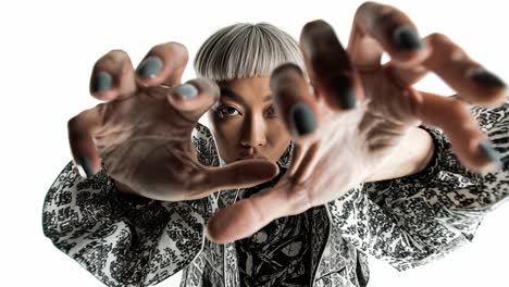 fashion model reaching towards camera in slow motion
