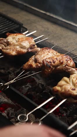 grilled chicken skewers on a charcoal grill