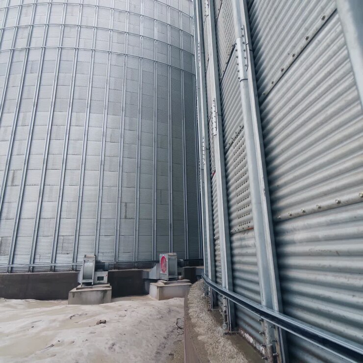 Food industry agricultural tank. Huge steel elevator storage
