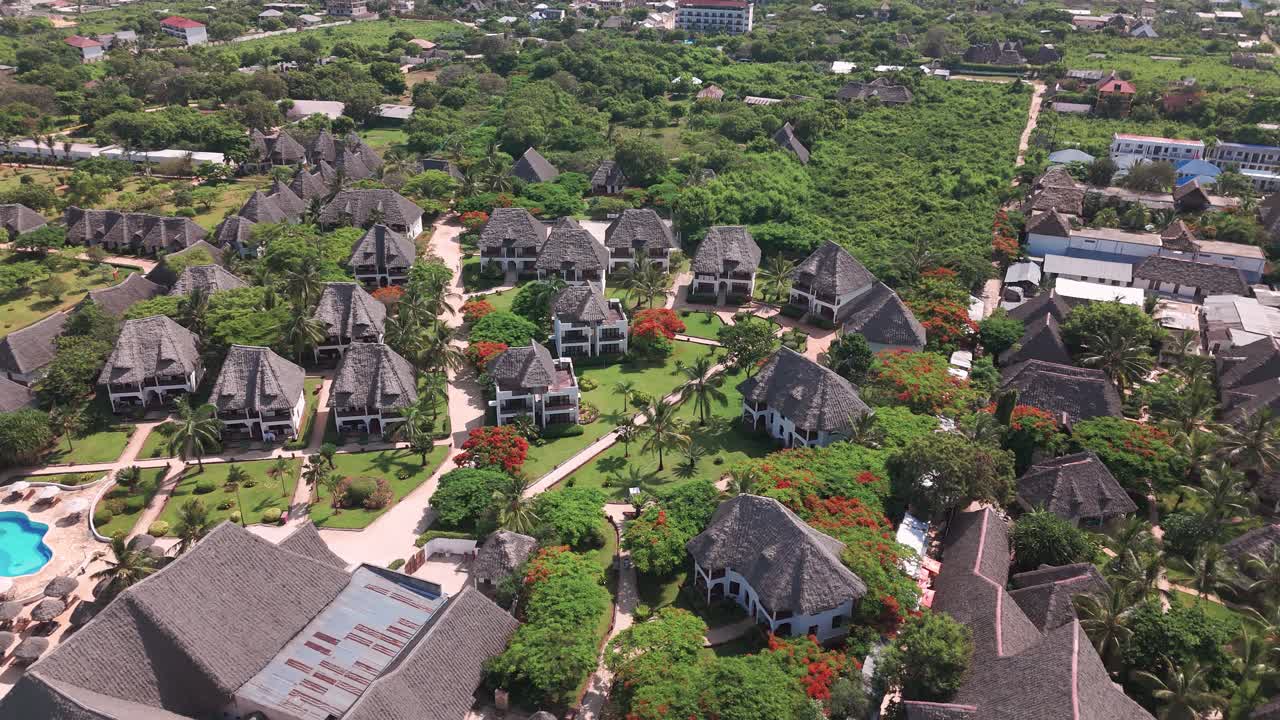 Holiday Destination On The Gorgeous Tropical Island Of Zanzibar In Nungwi, Tanzania. Aerial Pullback Shot