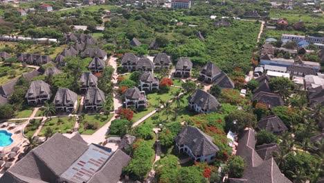 holiday destination on the gorgeous tropical island of zanzibar in nungwi, tanzania. aerial pullback shot