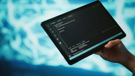 Close-up-of-IT-professional-using-tablet,-building-AI-algorithms