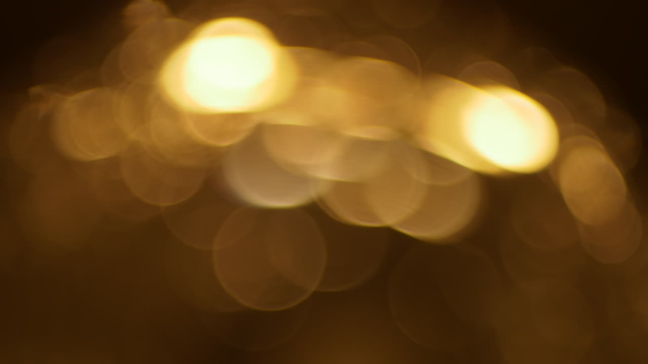 Cerchi di luce bokeh dorati astratti e scintillanti