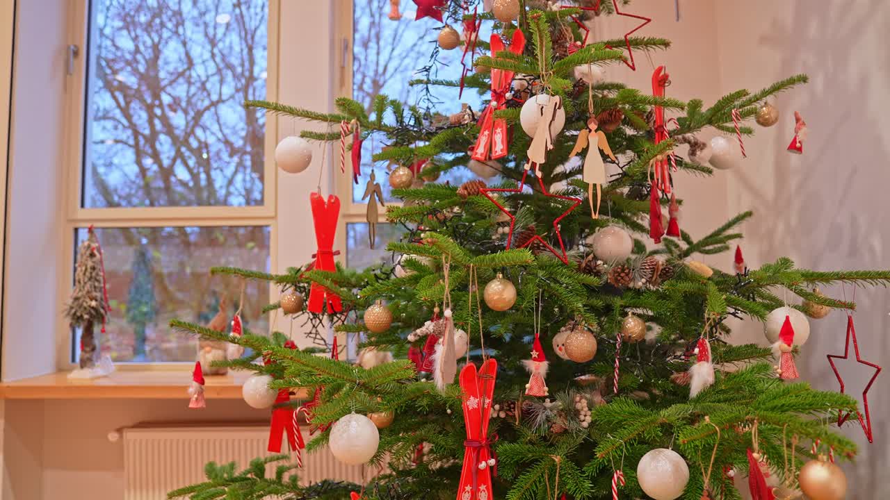 christmas tree decoration indoors in a warm and cozy festive ambient.