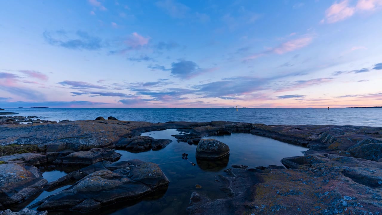 Timelapse view of sunset clouds over Baltic Sea islands from Suomenlinna Finland