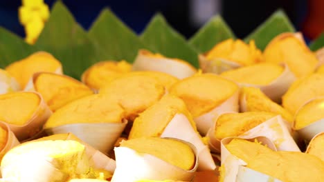 display of vibrant yellow toddy palm cakes