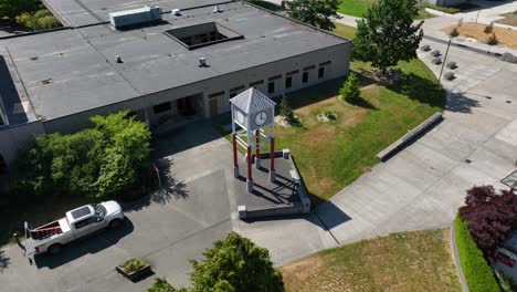 drone shot orbiting the south seattle college clock tower on a sunny day