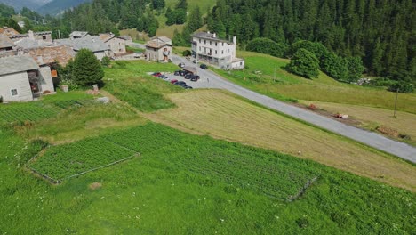 a tractor arrives at a village near busca, cuneo, piedmont in italy