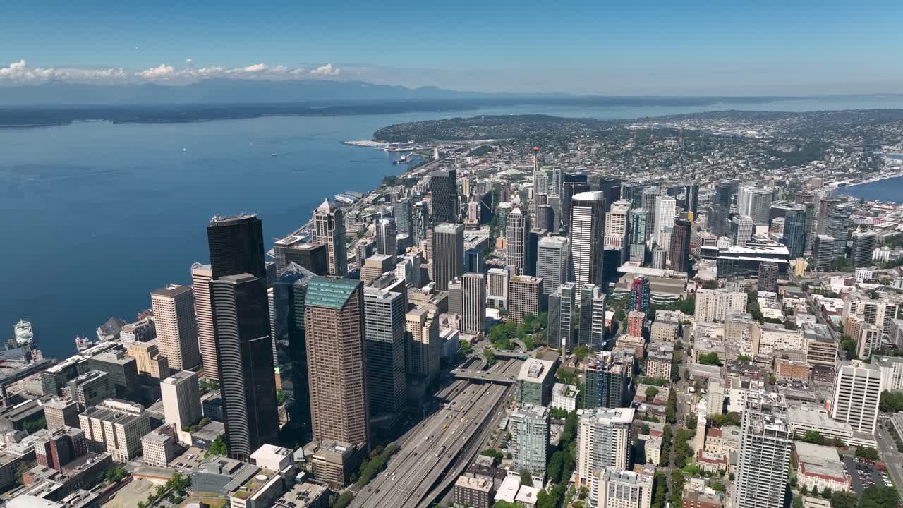Wide aerial view of Seattle's downtown skyscrapers standing over the Puget Sound