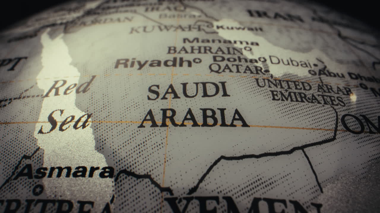 Close-up of a world globe highlighting Saudi Arabia and surrounding countries