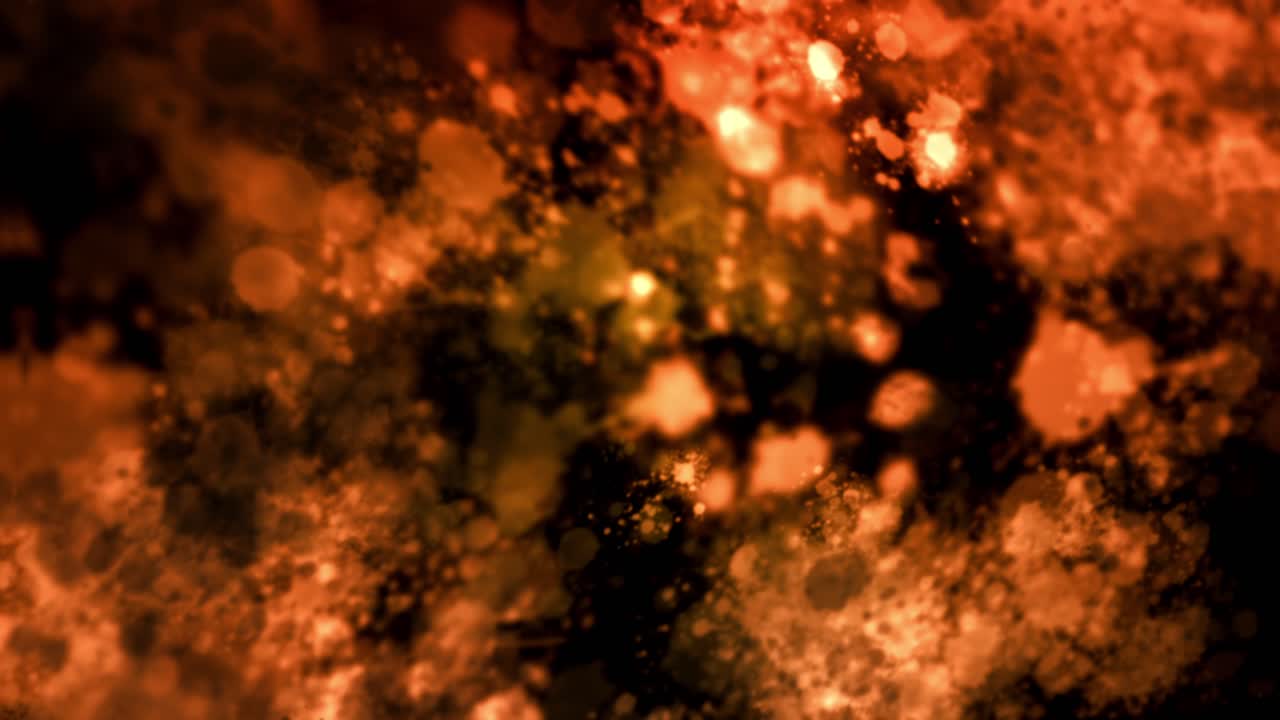 Abstract orange color fire motion graphics scene, where various-sized particles form a constantly moving and morphing scene with changing spotlight type of highlights