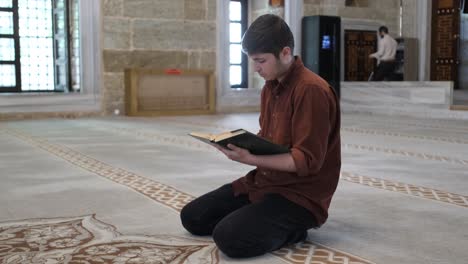 young man reading quran