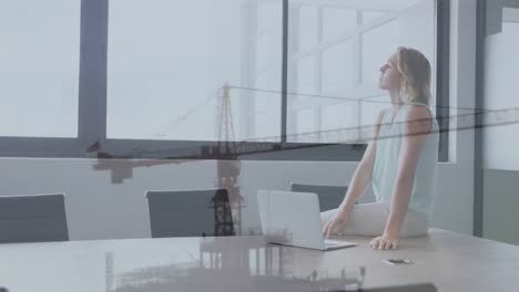 animation of caucasian businesswoman in office over crane in construction site