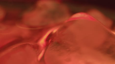 Close-Up-of-ice-and-liquid-rotating-in-whiskey-glass